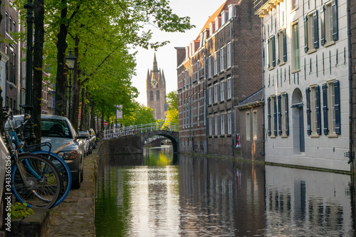 A view from a dutch canal with typical dutch houses and bridges.  © Wietse