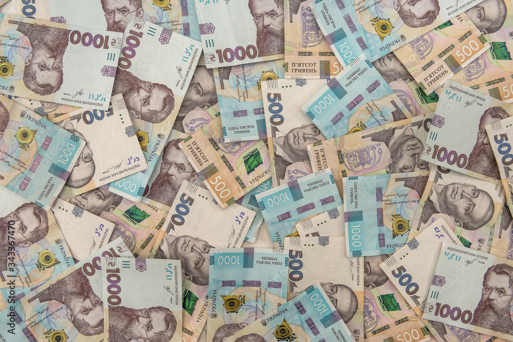 seamless texture of real new ukraine 500 and 1000 banknotes. Pile of hryvnia as financial background.