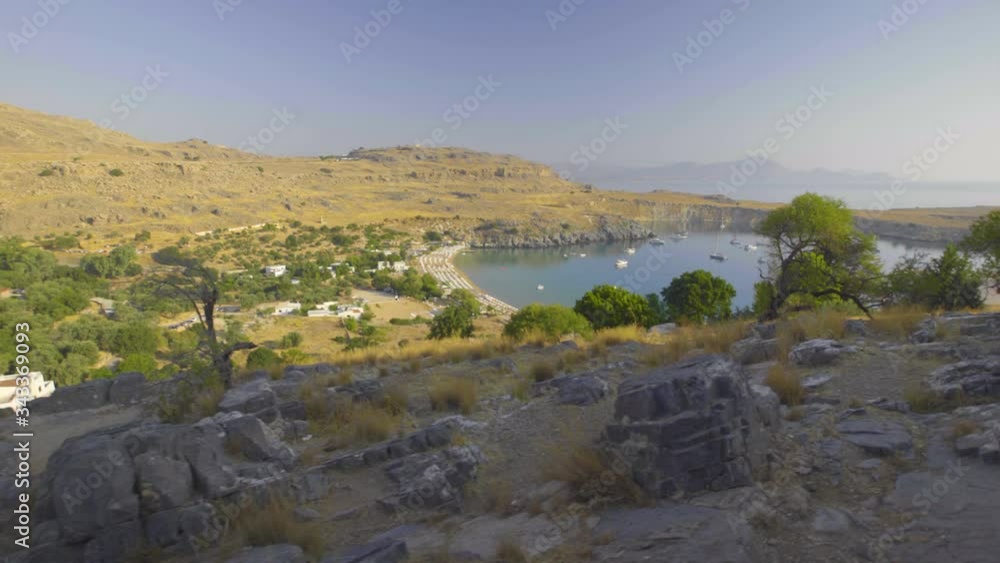 Lindos coast seen from Acropolis hillside, Summer, daytime, Lindos, Rhodes, Greece, 4K Lindos coast seen from Acropolis hillside, Summer, daytime, Lindos, Rhodes, Greece, 4K