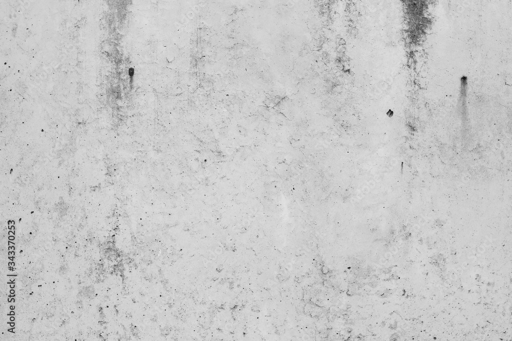 White concrete wall with black stains as background White concrete wall with black stains as background