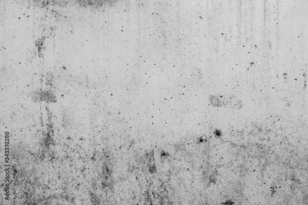 Fototapeta premium White concrete wall with black stains as background