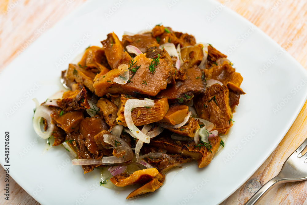 Pickled red pine mushrooms with onion