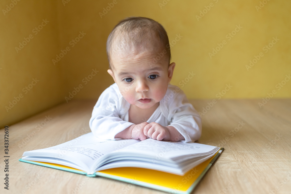 Newborn baby with book. A little boy in white bodysuit . Beautiful portrait of a toddler. Big-eyed baby. Remote education. Distance learninig
Newborn baby with book. A little boy in white bodysuit . Beautiful portrait of a toddler. Big-eyed baby. Remote education. Distance learninig