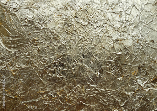 Wrinkled texture background. Golden with a copper tint antique handmade  crumpled paper. Potal, jammed foil.