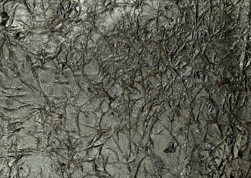 Bronze wrinkled paper texture abstract background. Antique dark bronze jammed foil texture, handmade crumpled texture.
