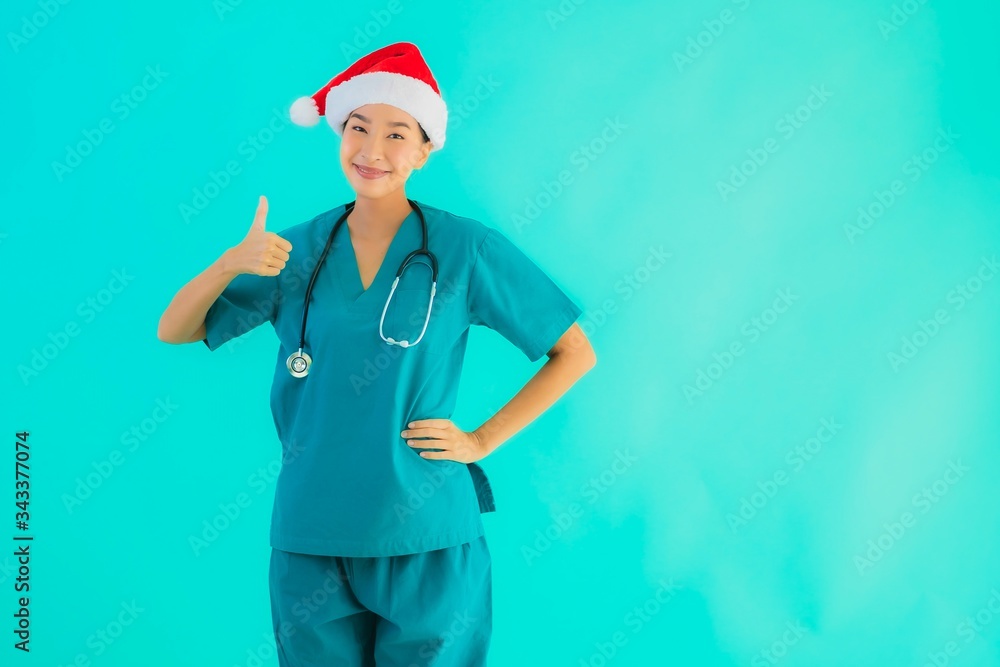 Portrait beautiful young asian doctor woman wear christmas hat Portrait beautiful young asian doctor woman wear christmas hat