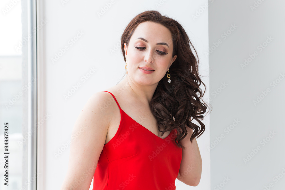 Close-up portrait of beautiful young woman with elegant hairstyle and luxurious jewelry and bijouterie. Close-up portrait of beautiful young woman with elegant hairstyle and luxurious jewelry and bijouterie.