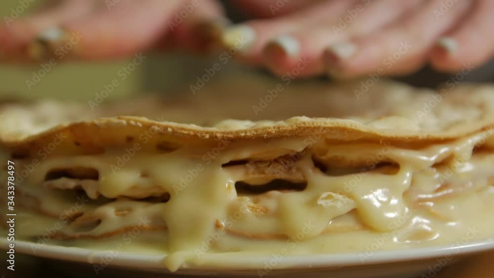 Hands press cake cream closeup Napoleon homemade puff pastry unrecognizable female hand Hands press cake cream closeup Napoleon homemade puff pastry unrecognizable female hand