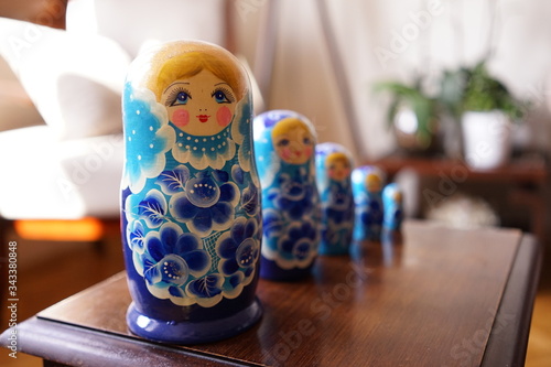 matryoshka dolls. Matryoshka dolls in sequence. local toys on the wooden table. 