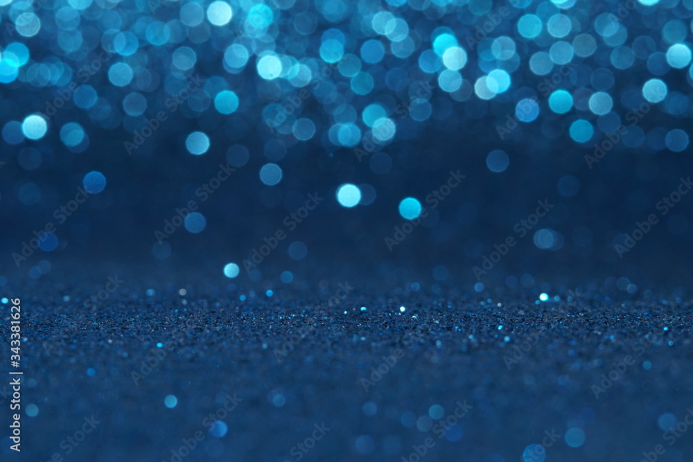 blue Sparkling Lights Festive background with texture. Abstract Christmas twinkled bright bokeh defocused and Falling stars. Winter Card or invitation blue Sparkling Lights Festive background with texture. Abstract Christmas twinkled bright bokeh defocused and Falling stars. Winter Card or invitation