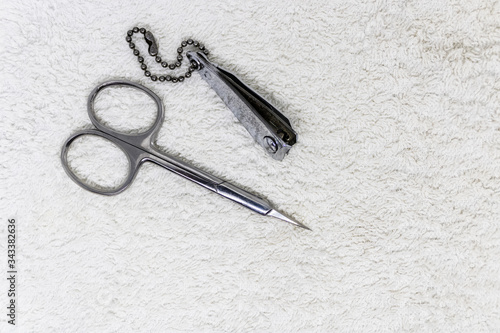 Metal scissors and nail clipper with keychain for manicure and pedicure - Image © Olena