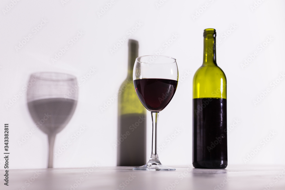 Shadow of wine glass in dark light. Shadow of wine glass in dark light.