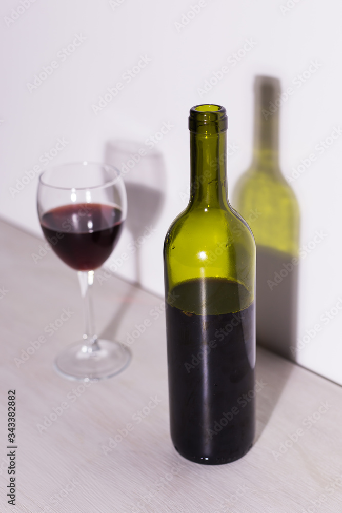 Shadow of wine glass in dark light. Shadow of wine glass in dark light.