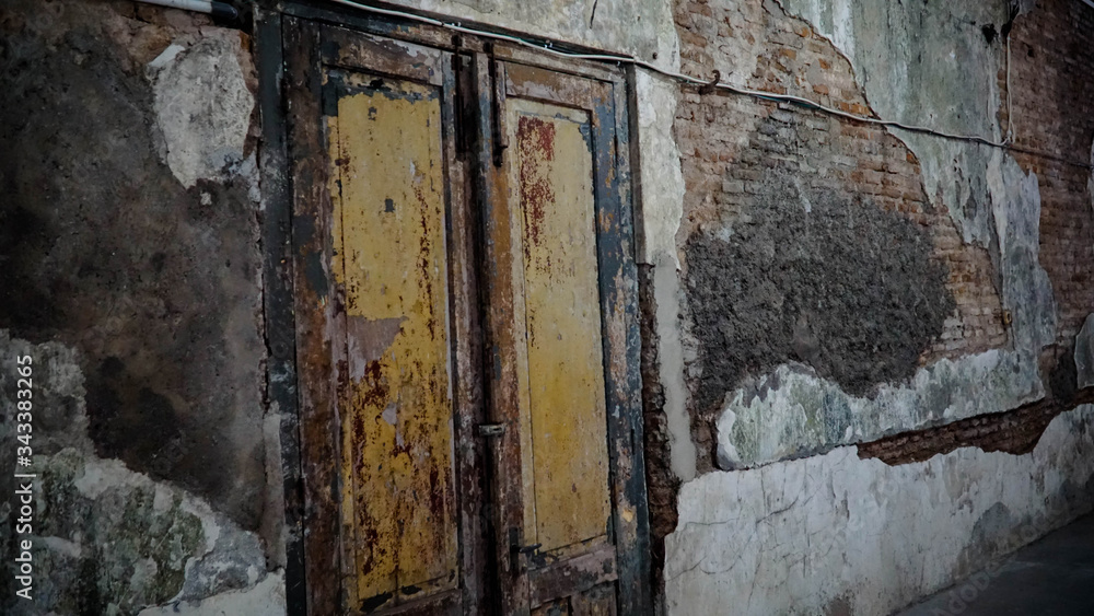 Iron fence ornaments and wooden doors in ancient Roman style buildings. Iron fence ornaments and wooden doors in ancient Roman style buildings.