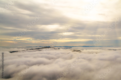 blue  sky with clouds   and sea of  mist  on the mountain at sunrise