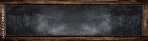 Empty blank old anthracite blackboard with wooden frame and space for text - School background, banner Panorama long