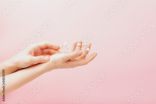 Flowers in a woman's hand, concept template feminine blog, social media, beauty concept © Ekaterina