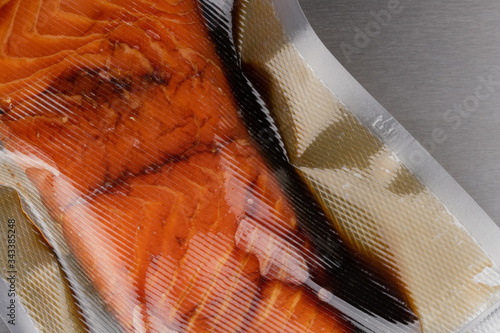 vacuum-packed marinated salmon closeup