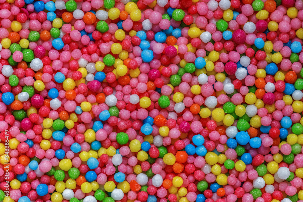 Texture Closeup of Sweet Green, Yellow, Blue, Pink, White Dragee. Texture Closeup of Sweet Green, Yellow, Blue, Pink, White Dragee.