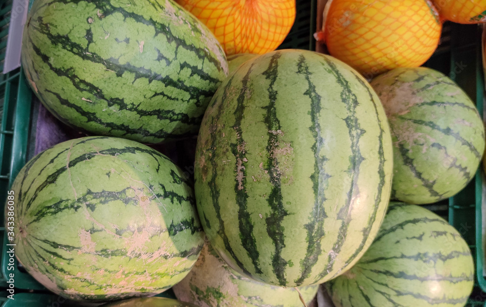 Watermelon for sale in fruit and vegetable gondolas in supermarket