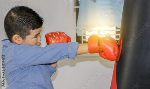 A boy punching boxing Exercising at home