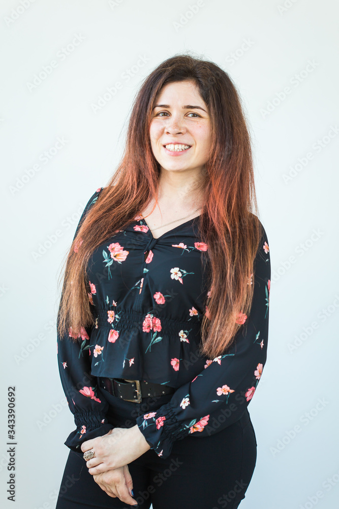 Playful and happy funny redhead woman having fun laughing on a white background. Playful and happy funny redhead woman having fun laughing on a white background.
