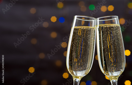 Close-up of two glasses with bubbly champagne