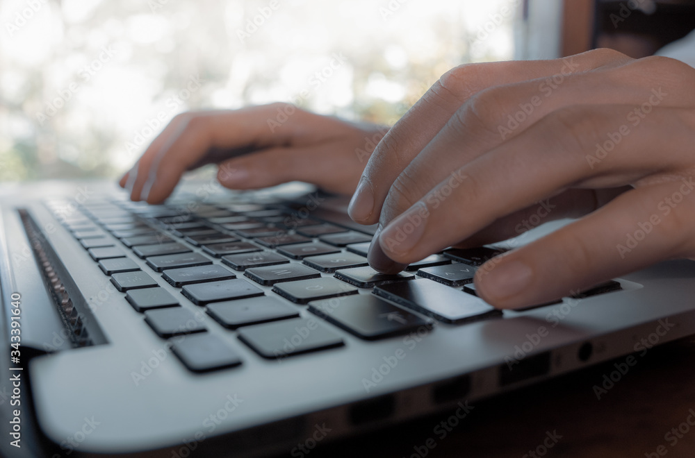 close up shot of Typing hands on laptop keyboard close up shot of Typing hands on laptop keyboard