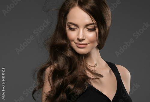 Hair Beautiful glamour woman long curly hairstyle black dress fashion natural make up female beauty