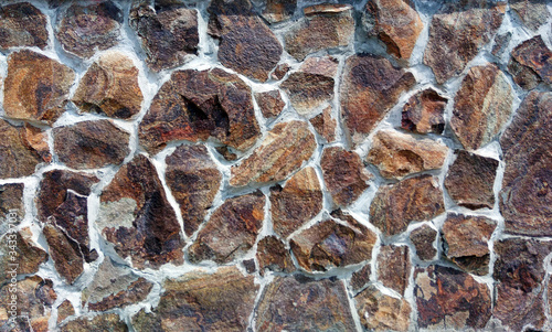 background of colored decorative stone on the facade