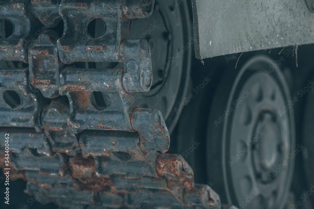 Caterpillar tracks of an old tank close-up
