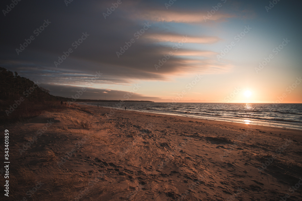 sunset on the beach at baltic sea