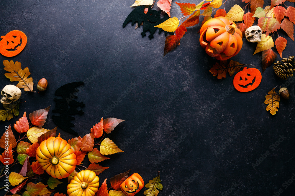 Pumpkins with Halloween decorations on dark background Stock Photo ...