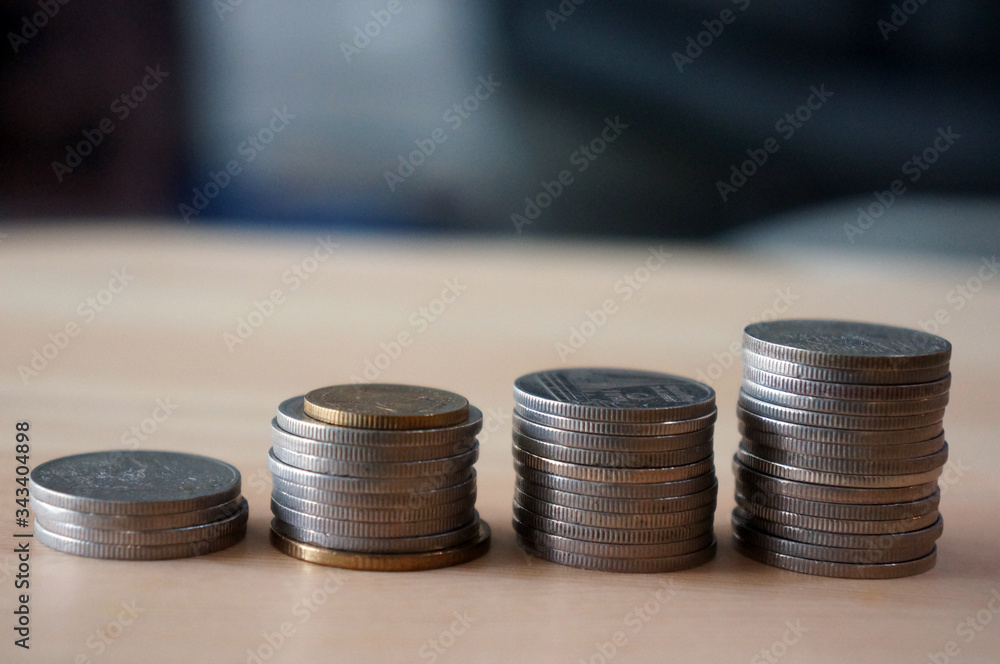 money coins to stack of coins. Money, Financial, Business Growth concept. money coins to stack of coins. Money, Financial, Business Growth concept.