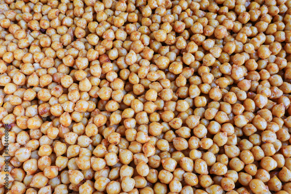 Marinated and cooked chickpeas with spices on an oven tray Marinated and cooked chickpeas with spices on an oven tray