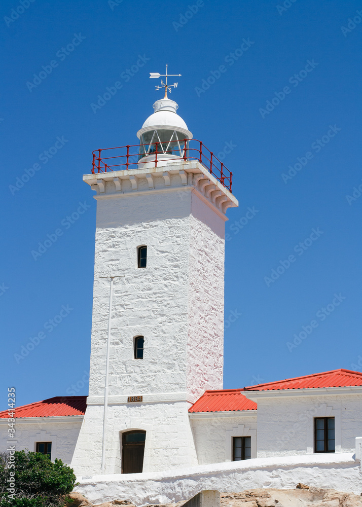Cape St Blaize lighthouse against blue sky during summer.