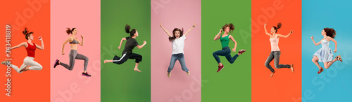 Young emotional people jumping high, look happy and cheerful on multicolored background. Celebrating women. Human emotions, facial expression concept. Trendy colors. Creative collage made of 4 models. © master1305