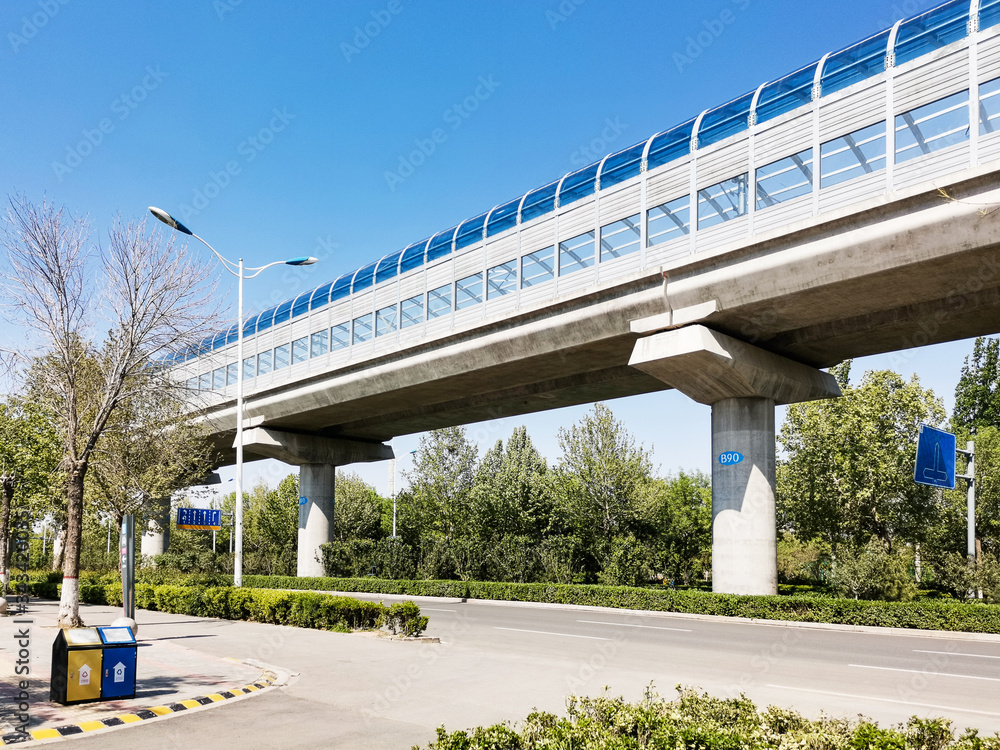 high speed railway light rail transit with sound insulation wall under blue sky high speed railway light rail transit with sound insulation wall under blue sky