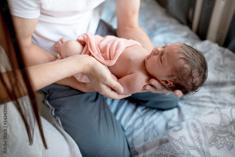 Newborn baby with mom and dad at home
Newborn baby with mom and dad at home