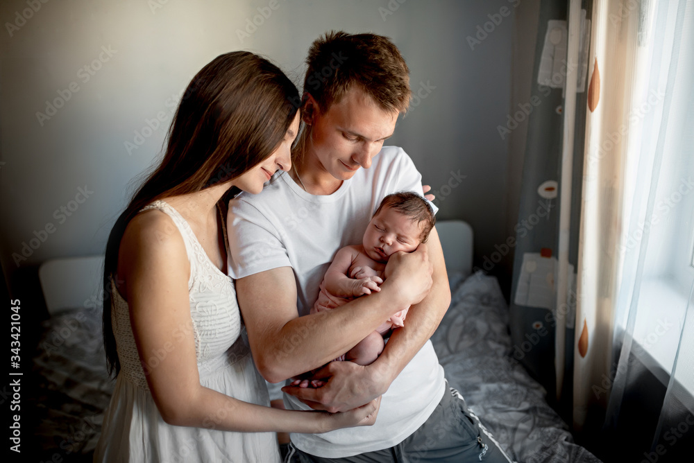 Newborn baby with mom and dad at home
Newborn baby with mom and dad at home