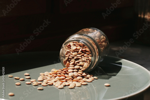green lentils in a glass jar © Metin