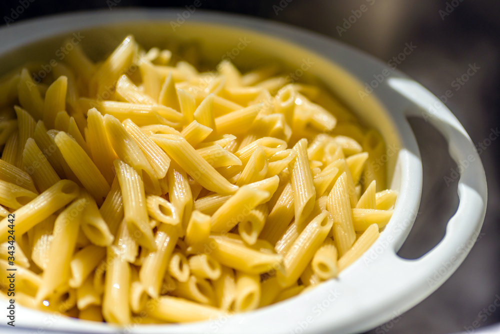 cooked italian penne rigate macaroni pasta draining cooked italian penne rigate macaroni pasta draining