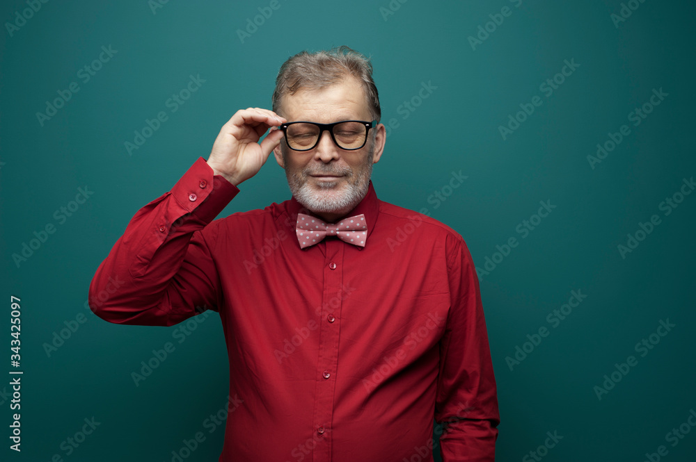 Portrait of a positive elderly man in glasses Portrait of a positive elderly man in glasses