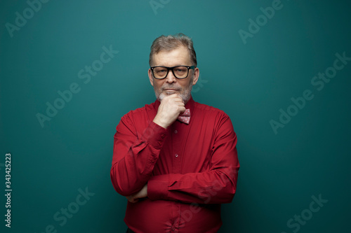 Portrait of a positive elderly man in glasses