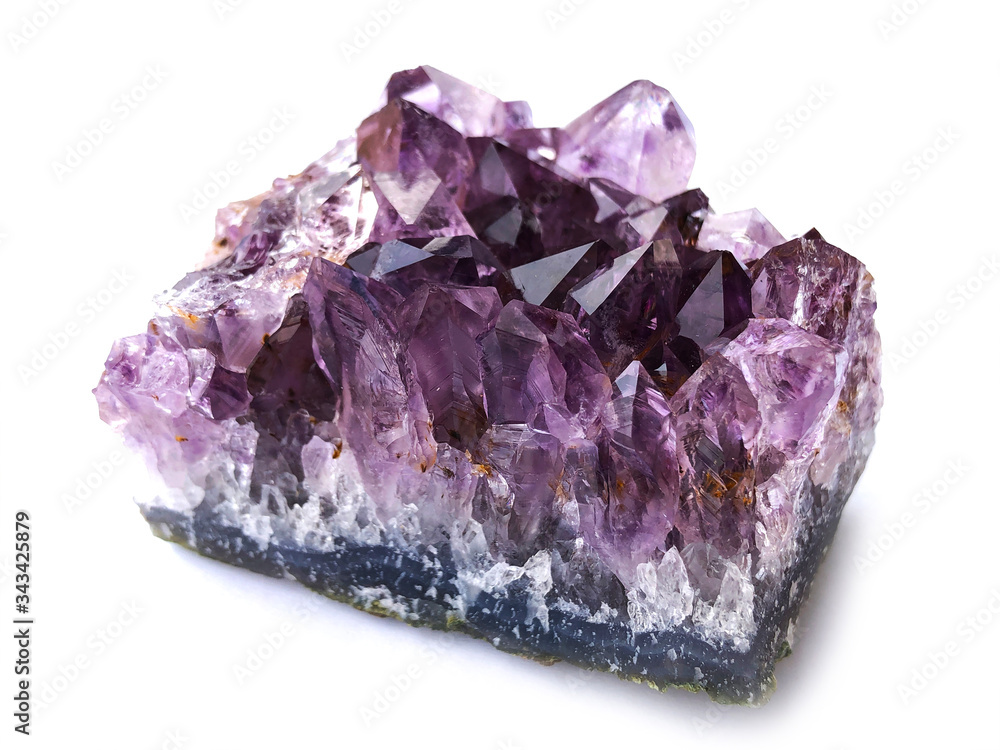 Fototapeta premium purple rough amethyst quartz crystals on white background