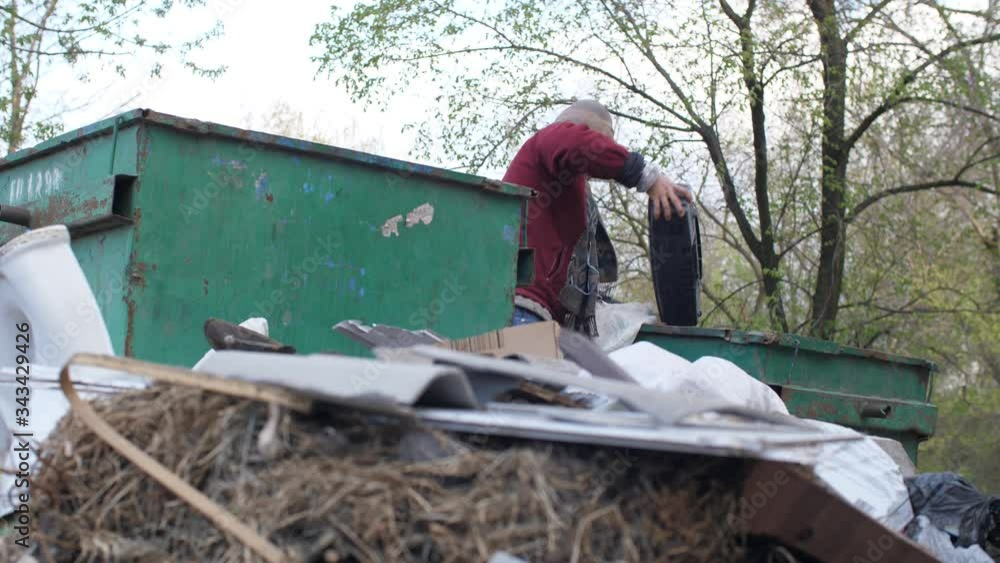 Beggar found an old tape recorder in the trash Beggar found an old tape recorder in the trash