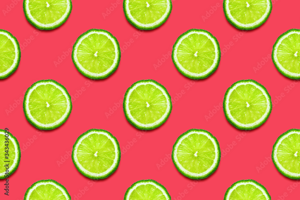 Lime slices seamless pattern on Crimson pink background. Minimal summer concept. Flat lay, trendy juicy color.