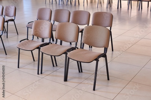 Chairs in rows in an empty autditorium, nobody around