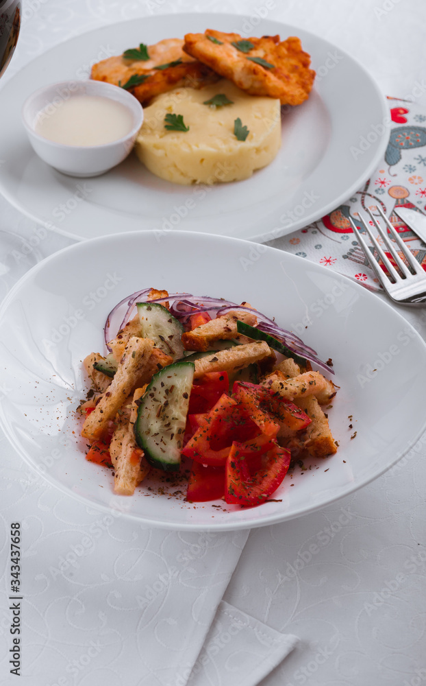dinner menu, feast and chicken cutlet with salad and red wine in combination with a tablecloth, tableware on the table
dinner menu, feast and chicken cutlet with salad and red wine in combination with a tablecloth, tableware on the table