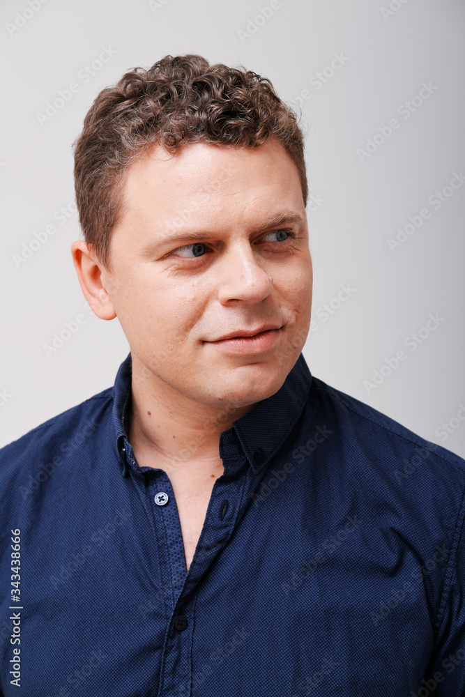 Studio portrait of man with hand on head Studio portrait of man with hand on head